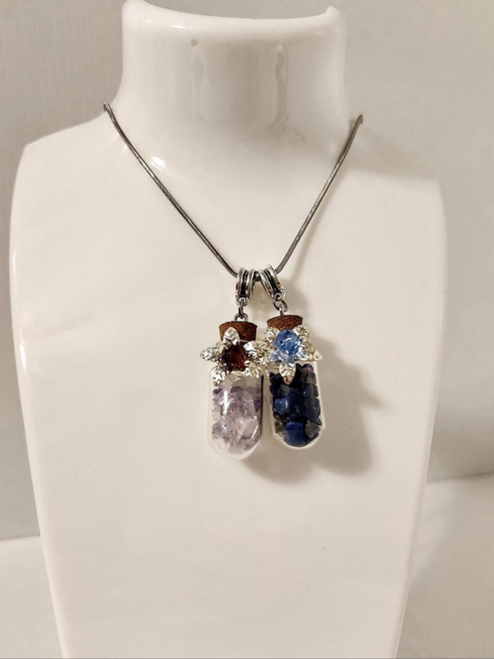Set Of Two Crystal Bottle Necklace Pendants in Silver, Blue, & Purple